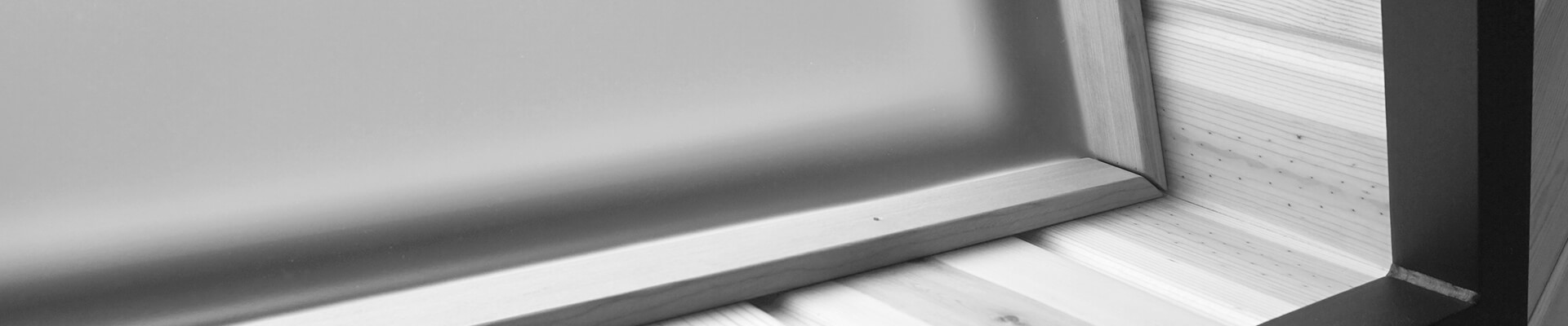 A close-up view of the acrylic plexiglass window coverings in the Mini Dome in black and white.